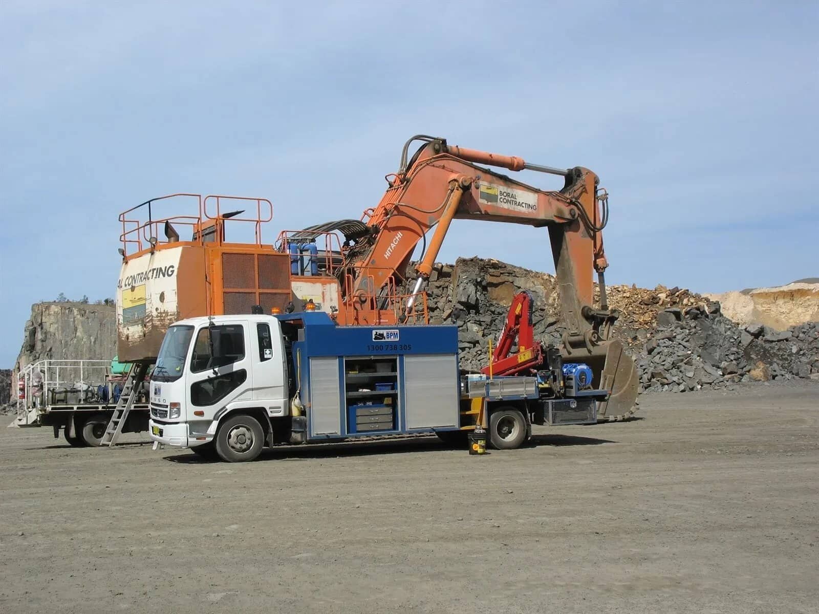 Large digger getting repaired on a worksite in the Illawarra