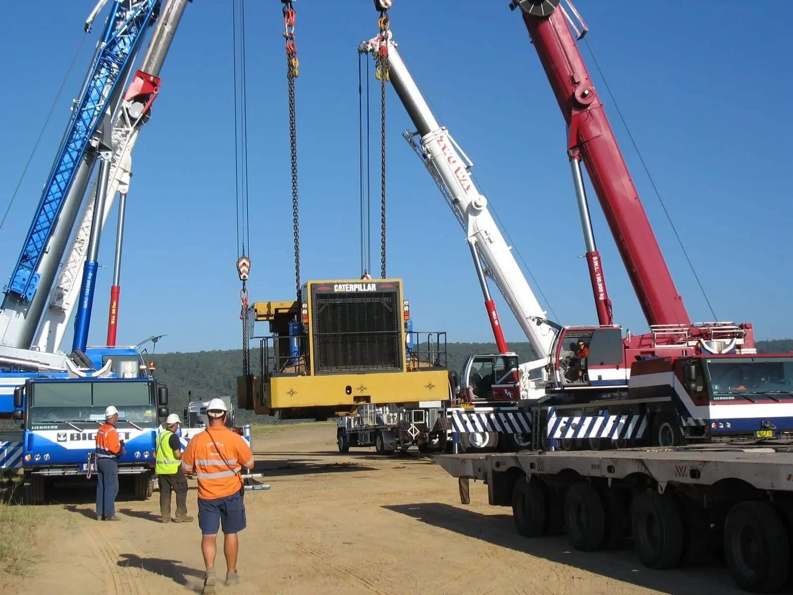 Cranes lifting heavy plant machinery
